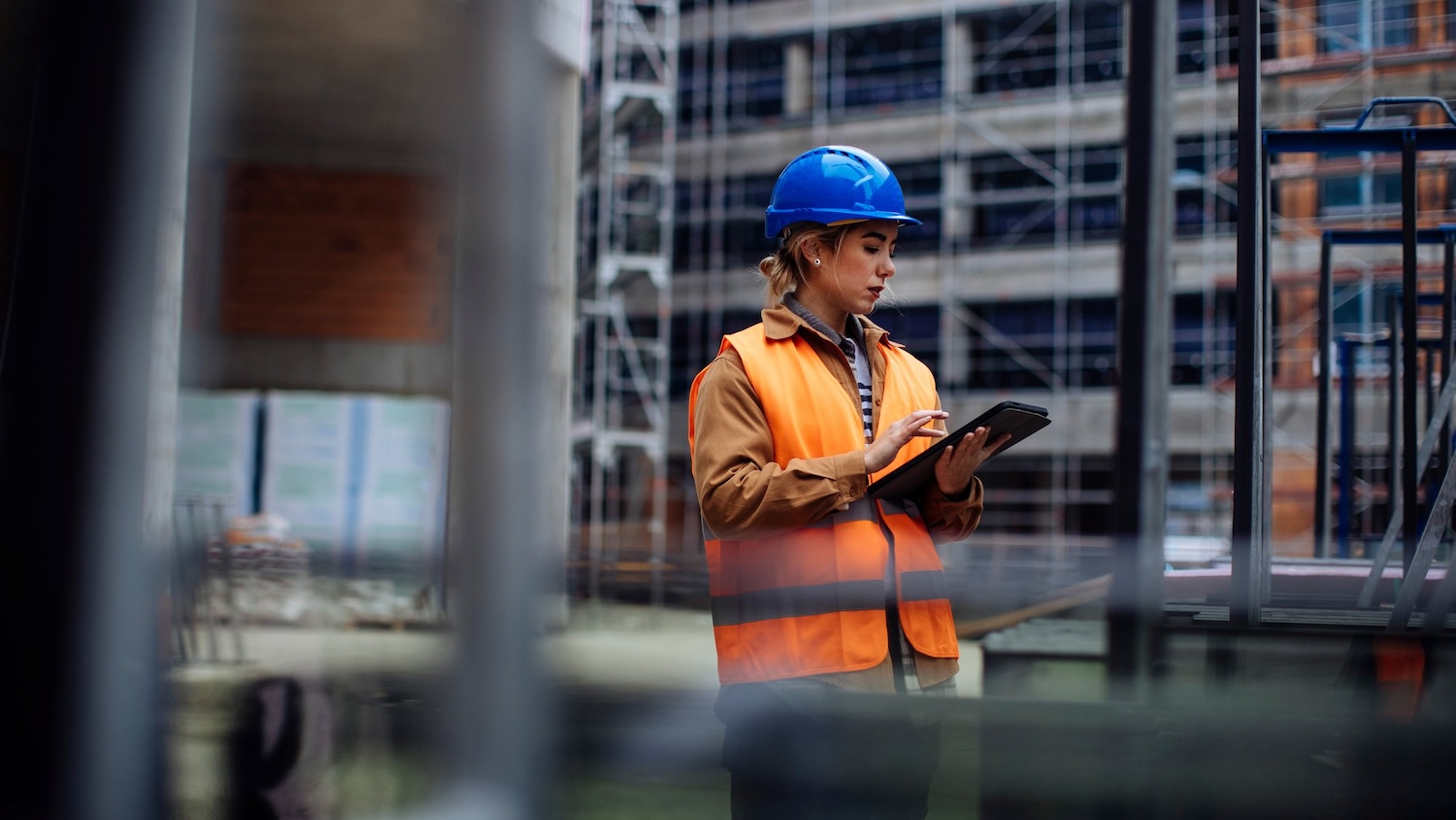 Photo of a woman working on site with a tablet - for Causeway opinion